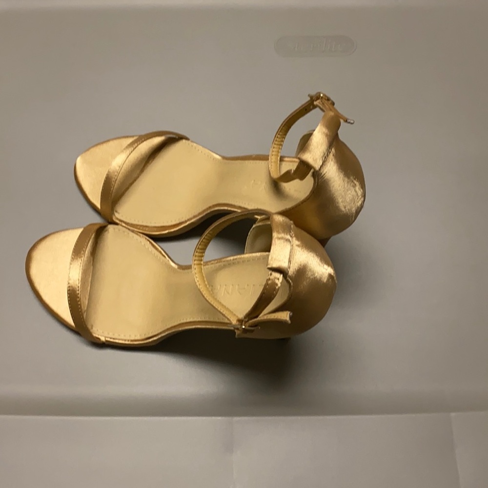 Gold classy stiletto  heels.